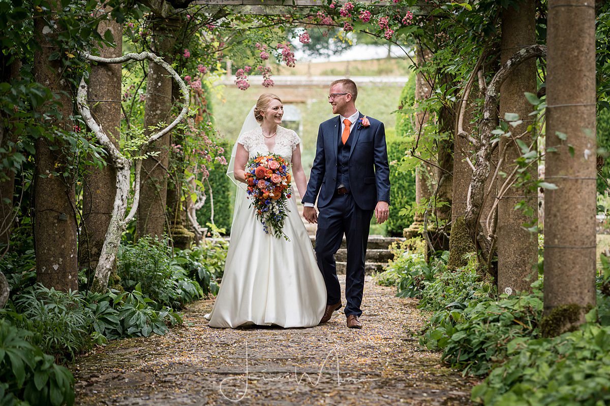 Bride & groom portrait in gardens